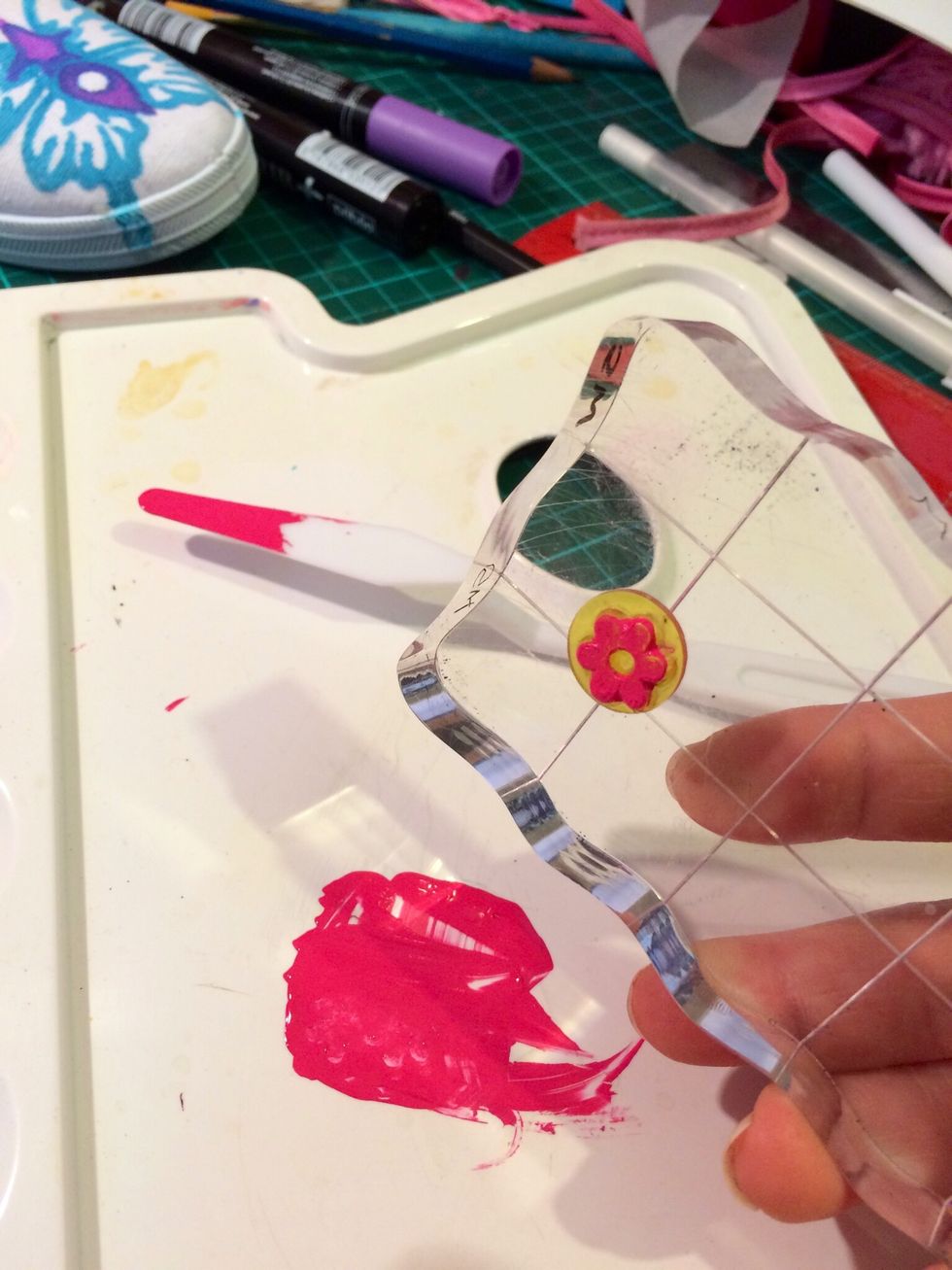 A very small flower stamp saved me from drawing them. You could use just stamps for the whole shoe if you wanted. I spread a thin layer of SetaSkrib paint on my pallet to stamp into.