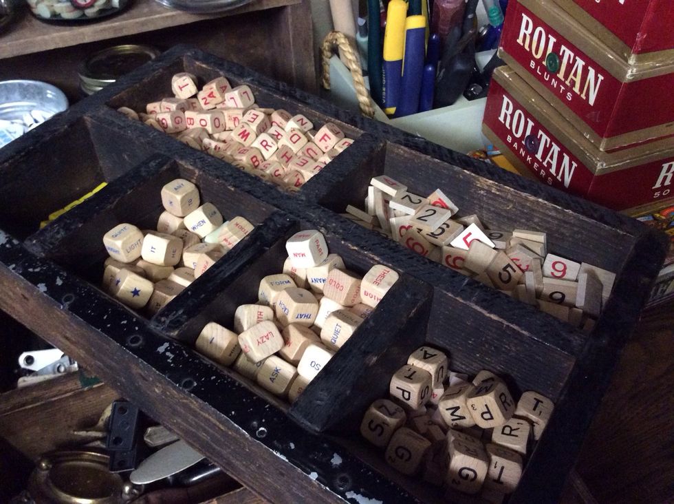 A vintage cash register drawer serves a new, more playful duty, organizing game pieces.