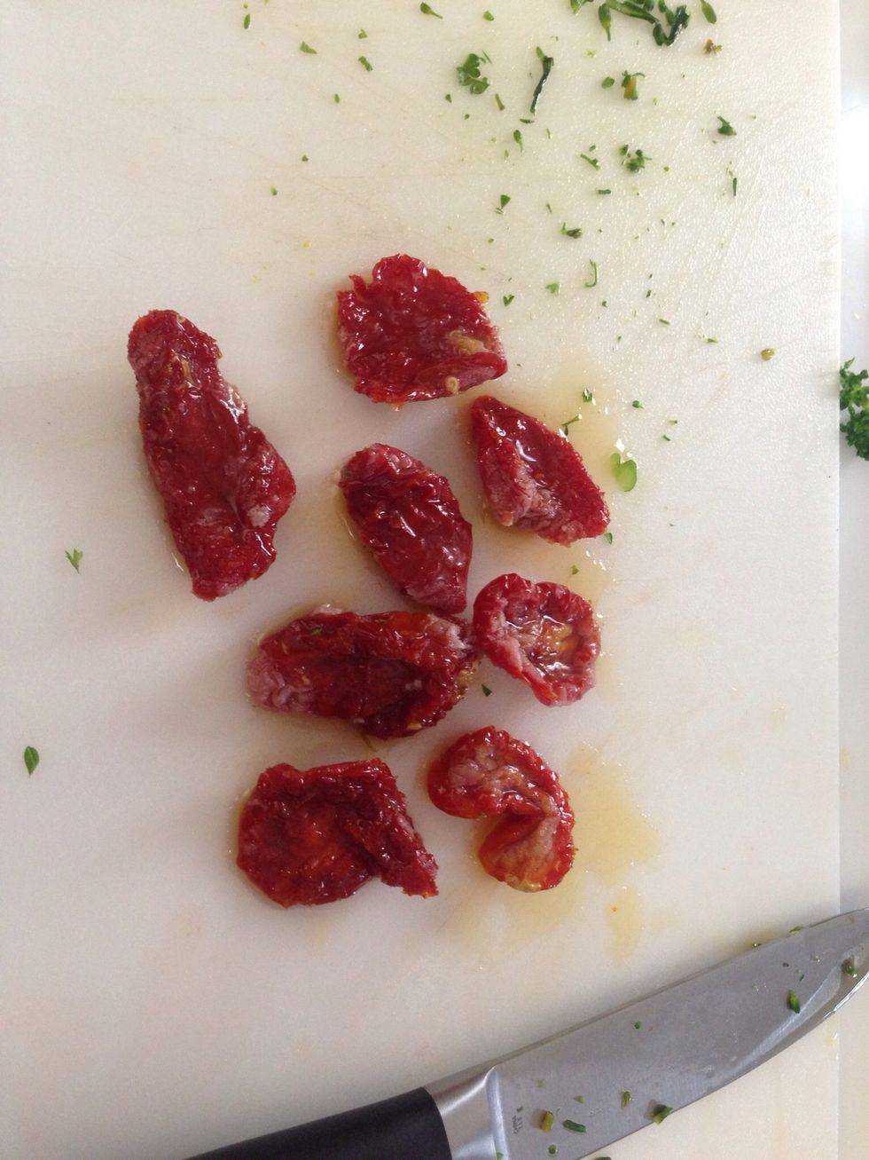 About 1/2 a jar of Sun Dried Tomatoes packed in olive oil (you be the judge). Give them a quick chop.