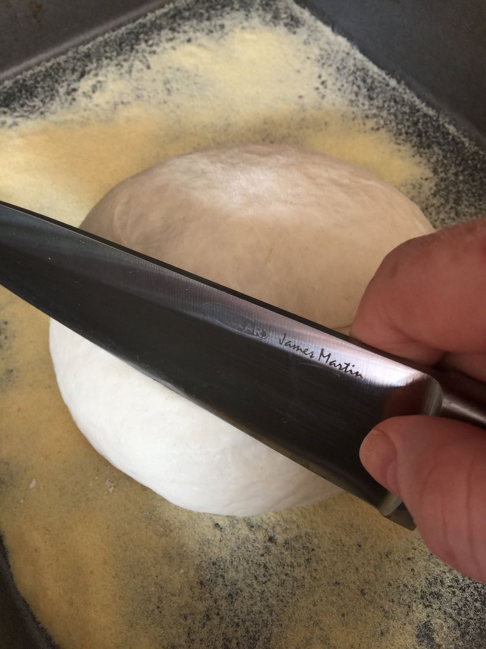 About 15 minutes before they go into the over, I score the top of the dough with a sharp knife or razor blade. I put several, parallel lines across the tops of the loaves.