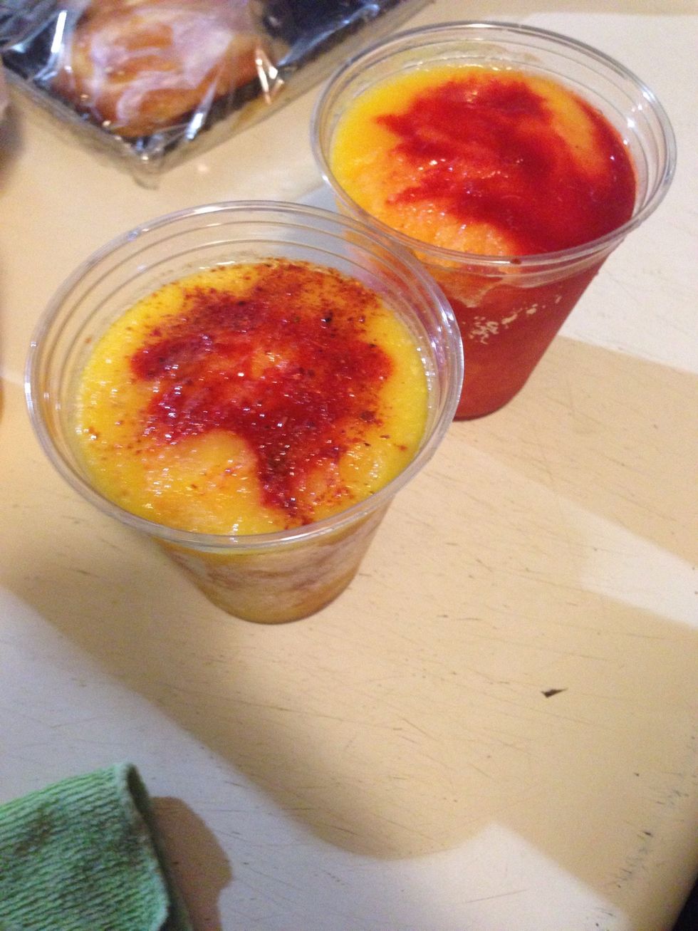 About an hour later take them out And put a plastic spoon in the middle. You can dip the popsicle right back in to get that spicy Chili mixture in every but but besides that enjoy!