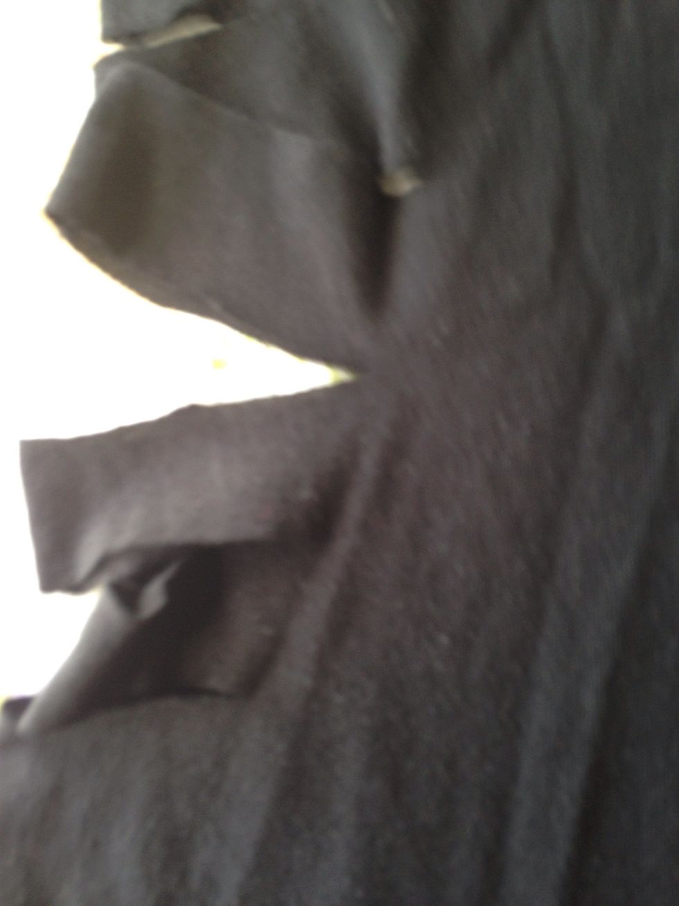About at the point of the shirt that will fall near the bottom of rib cage ( the smallest point on the female torso) cut longer slits about an extra inch deeper.