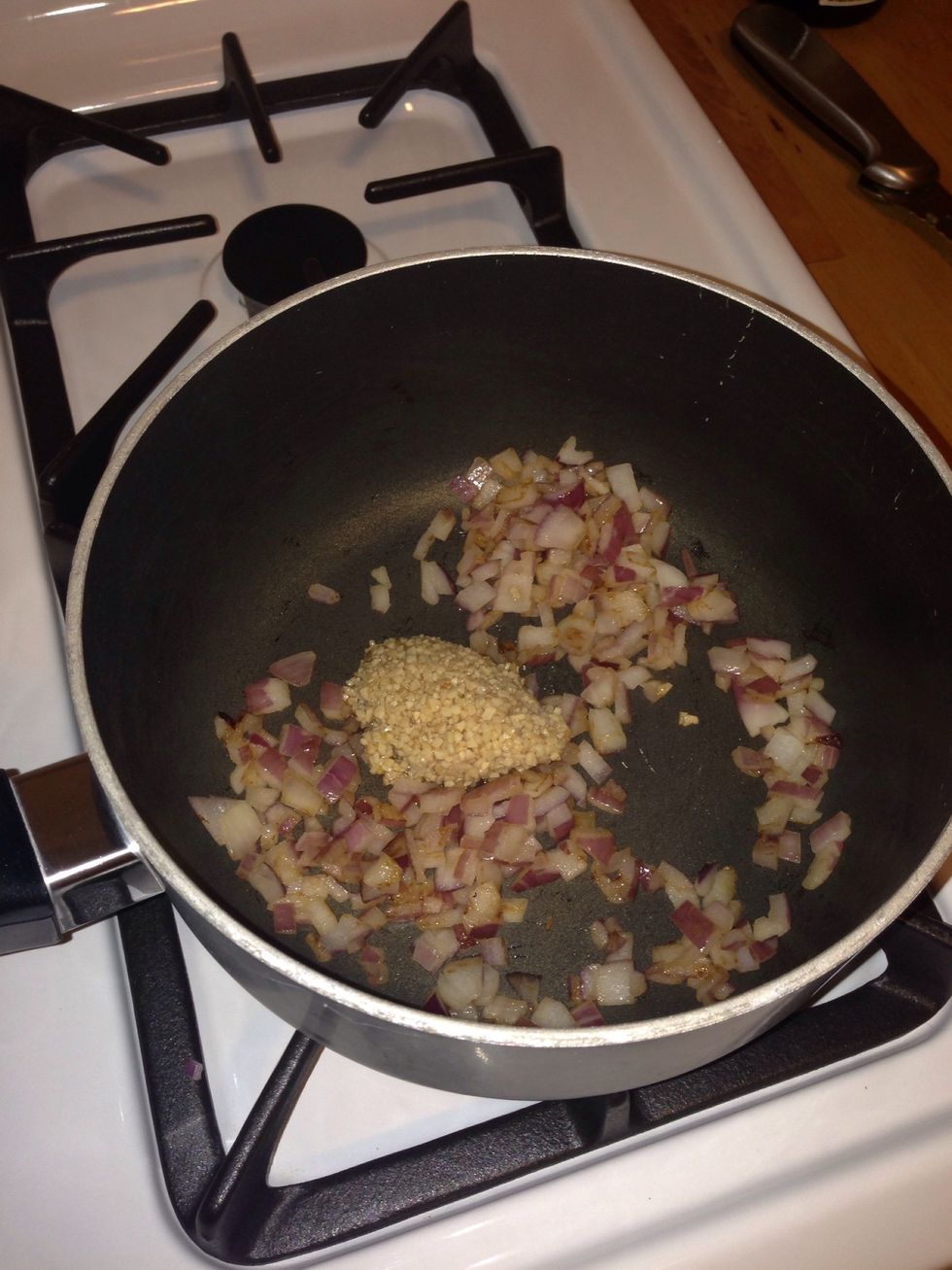About halfway through, add 1 tbsp of minced garlic. You can see they are halfway through when the onions start to brown. When the onions are finished, put to the side.