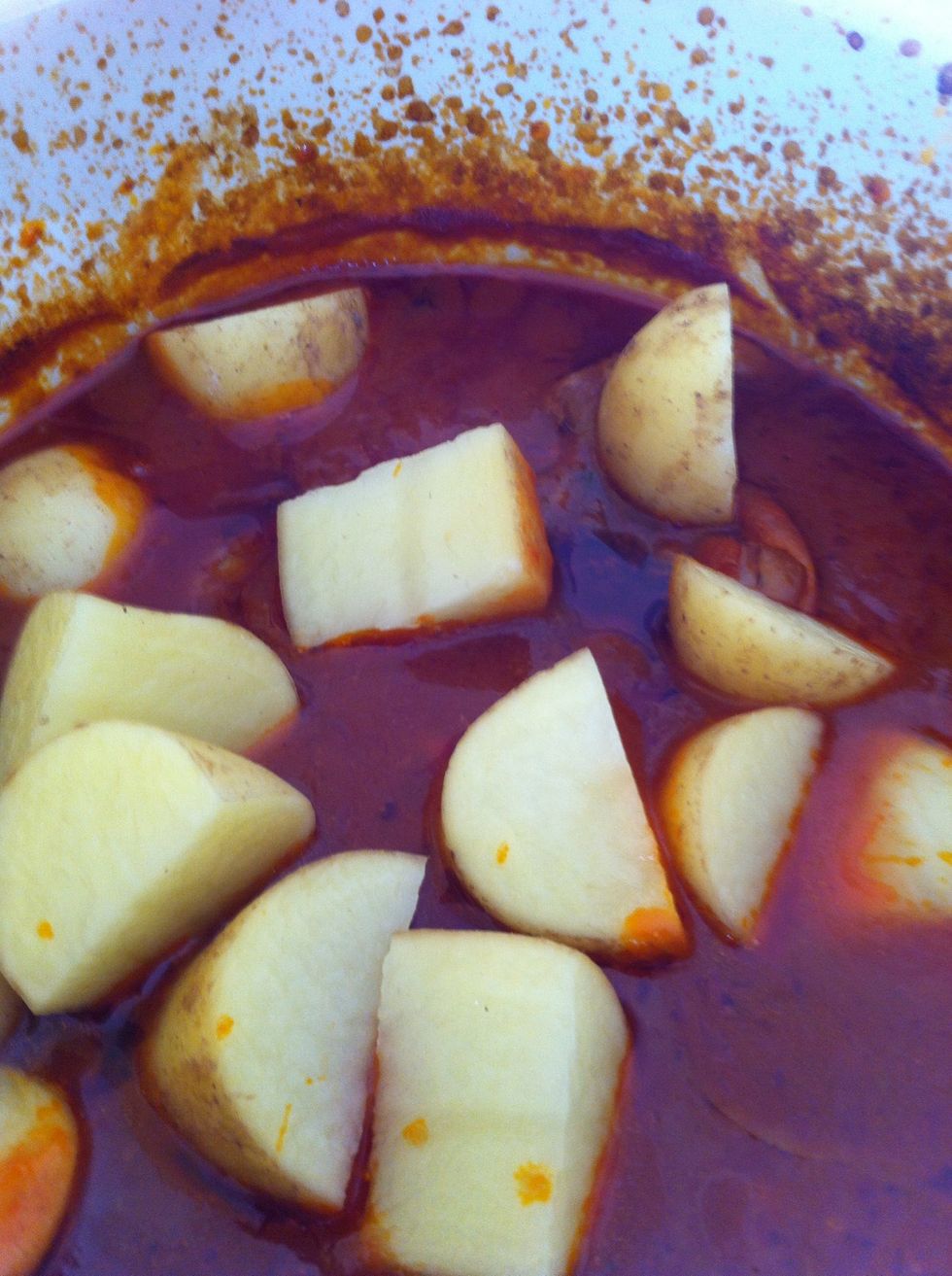 About one 90min into cooking add 4 baby potatoes that are diced into six pieces. Basically bitesize and easy to cook. Remember to add tinned beans of you choice like red kidney beans now, if you wish.