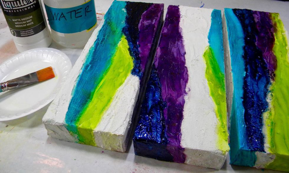 According to the directions for Kroma Crackle, after it drys and cracks, you must seal it by painting on a mixture of matte medium and water. This keeps the cracks from flaking off.