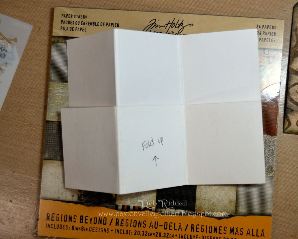 Accordion fold the paper by folding and burnishing on the lengthwise score lines. You will end up with three 'pages', each with a pocket on the front.