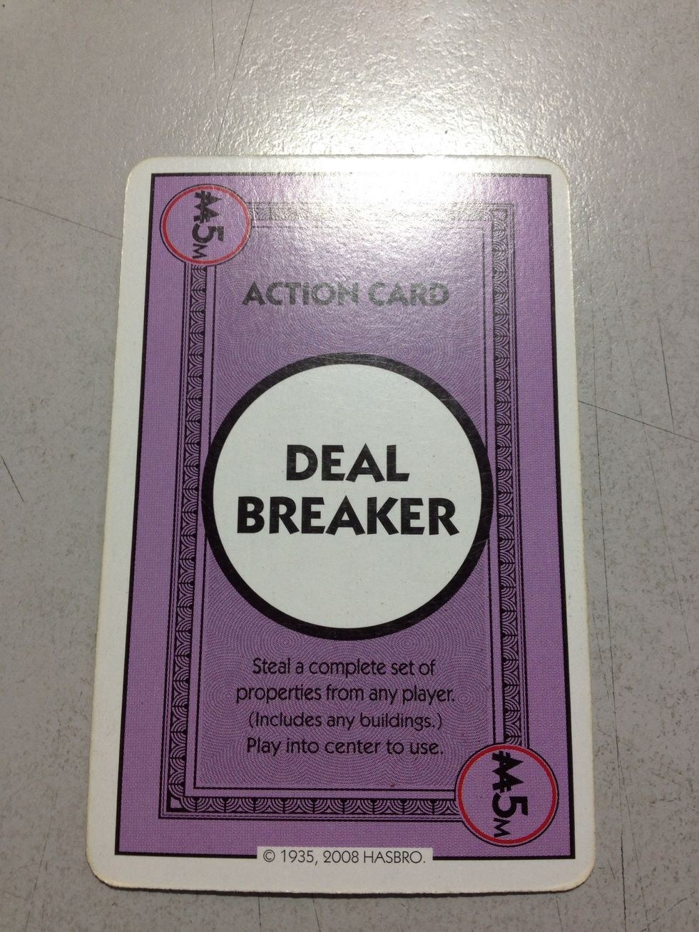 Action card: the game-changing card, Deal Breaker! Steal a complete set of property displayed by another player, including buildings. 2 cards available per game.