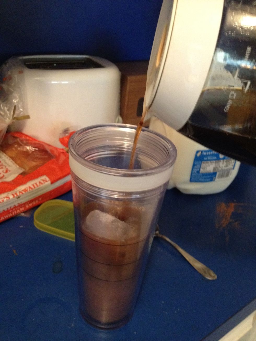 Action shot!!!  Just kidding, fill 'er up and mix well.   Add more ice if you want it really cold. Most of the ice melts when you pour the coffee in.