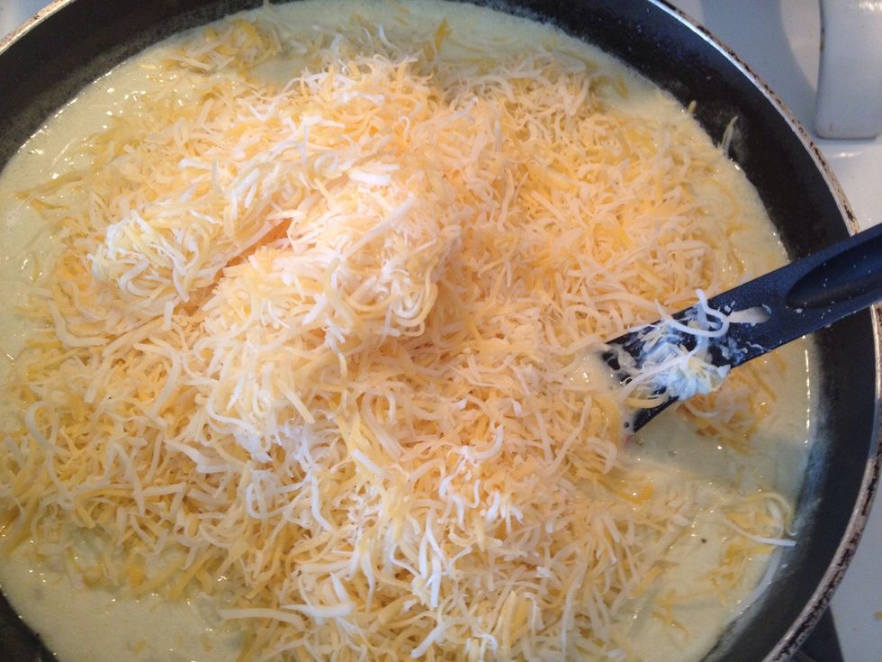 Add 1 1/2 cups grated cheese. Stir slowly.