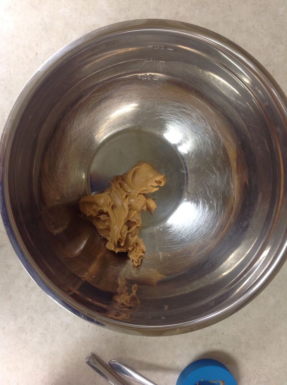 Add 1 1/2 cups of peanut butter in a large bowl.