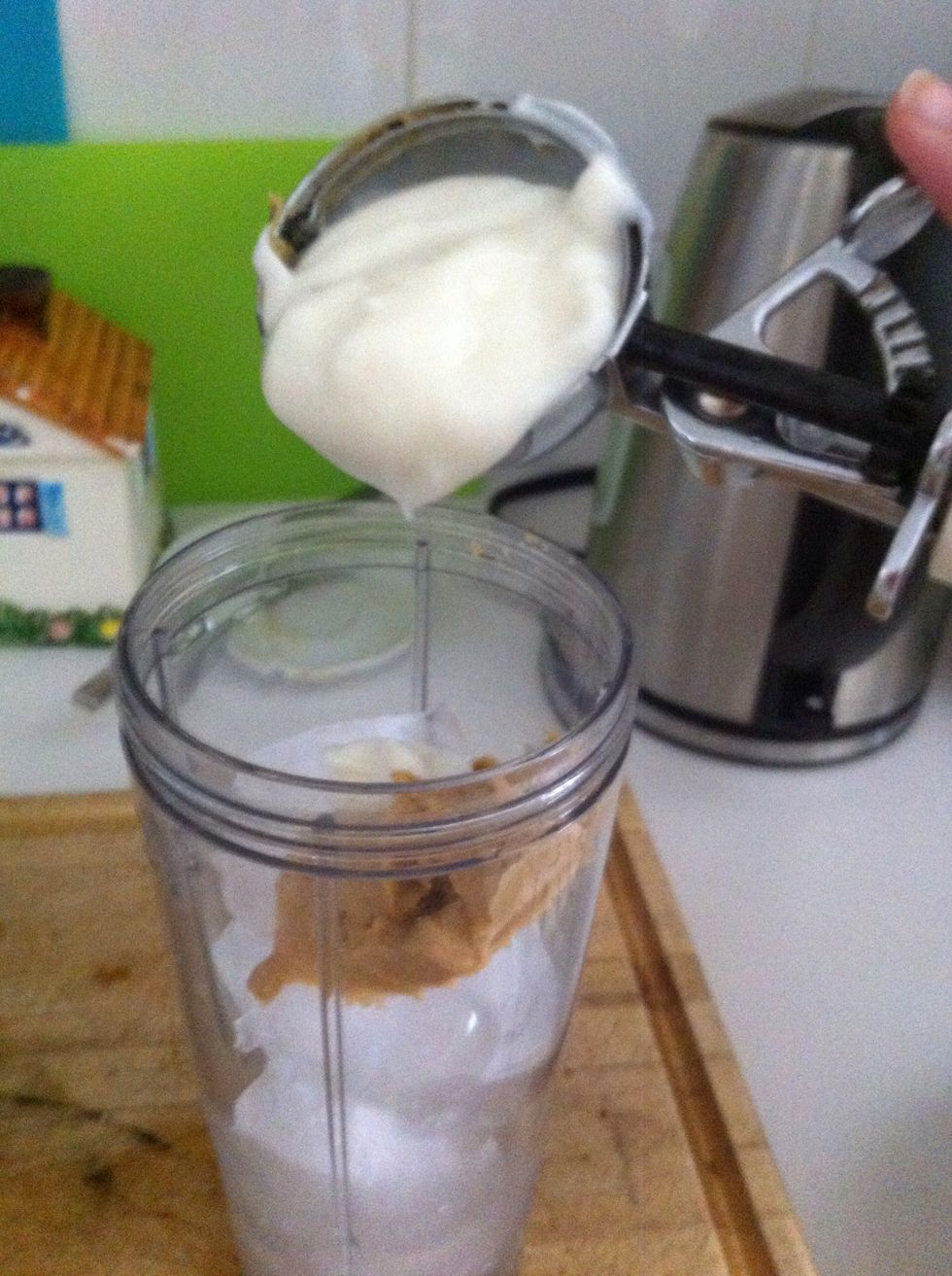 Add 1 1/2 icecream scoops of yogurt! If frozen, the better! You could also use ice cream if your a super sweetooth :)