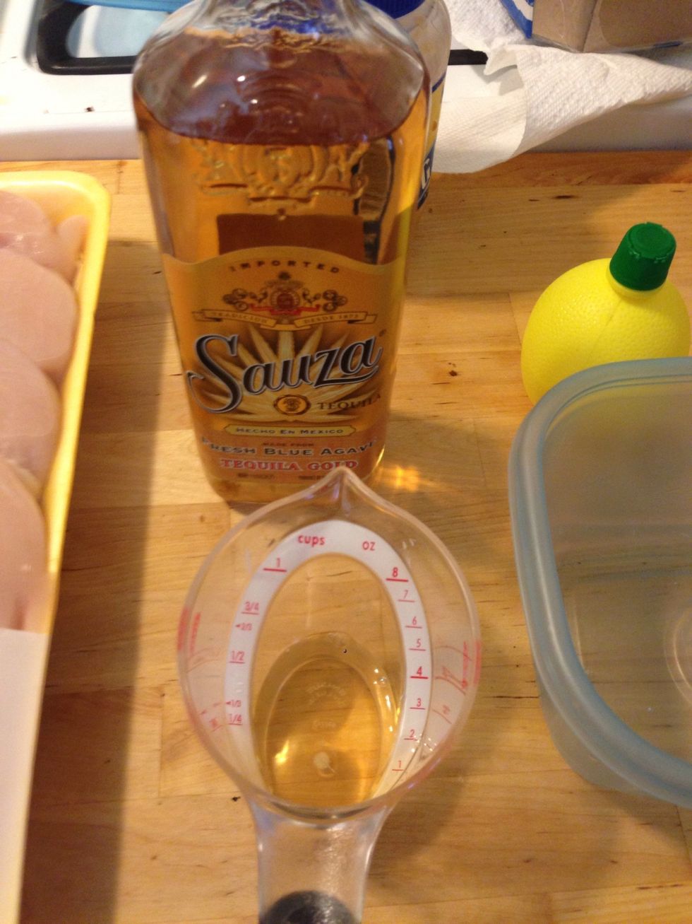 Add 1 1/2 oz of tequila and 1/2 oz of triple sec to a close able container.