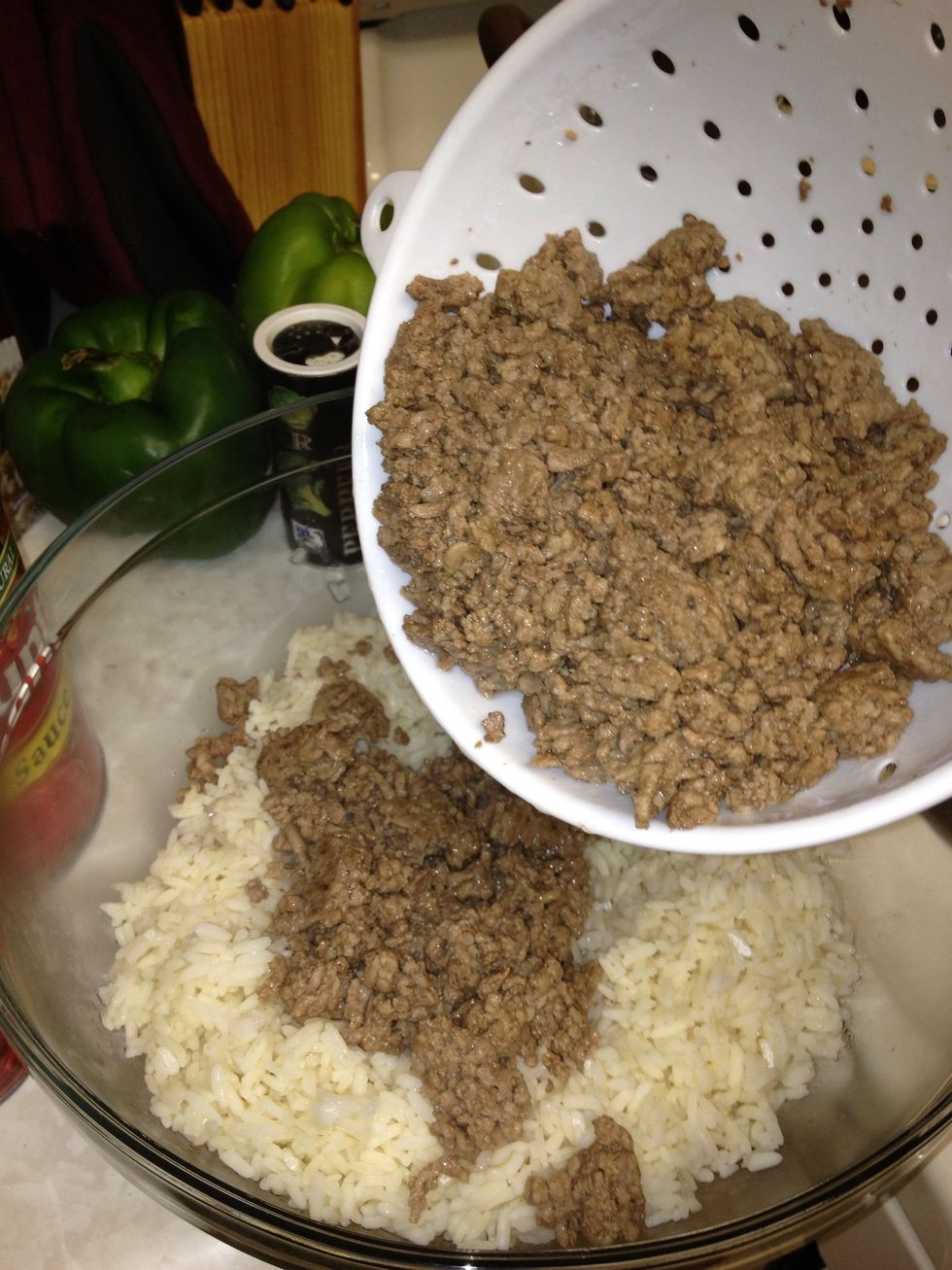 Add 1 1/2 pounds of ground beef to the rice.