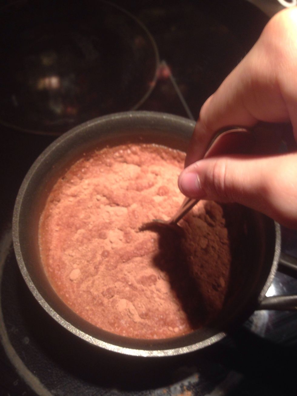Add 1 1/2 spoons of hot chocolate mix into the warming milk, and stir