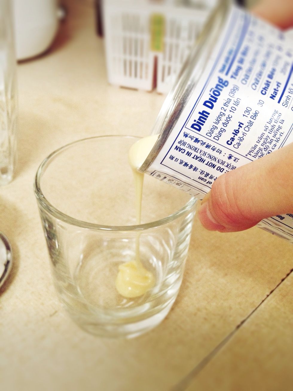 Add 1 1/2 tablespoons of condensed milk to small cup