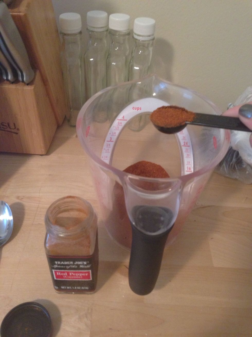 Add 1 1/2 Tbsp of cayenne powder or 3 if you like it spicy.