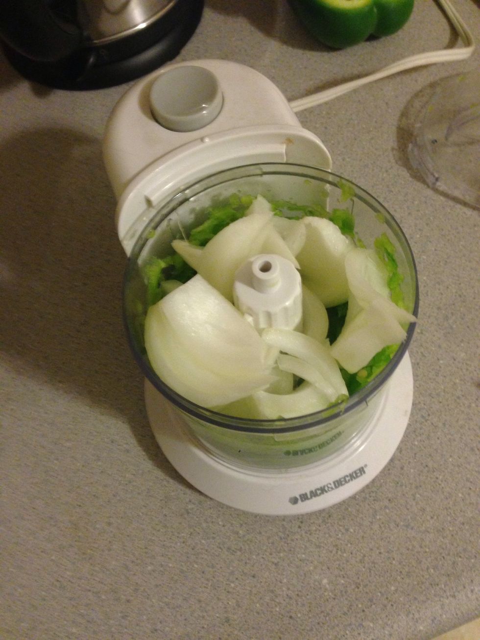 Add 1/2 bell pepper and 1/2 onion into a blender and mix (or mince them yourself). I also threw in a optional 2 garlic cloves. :)