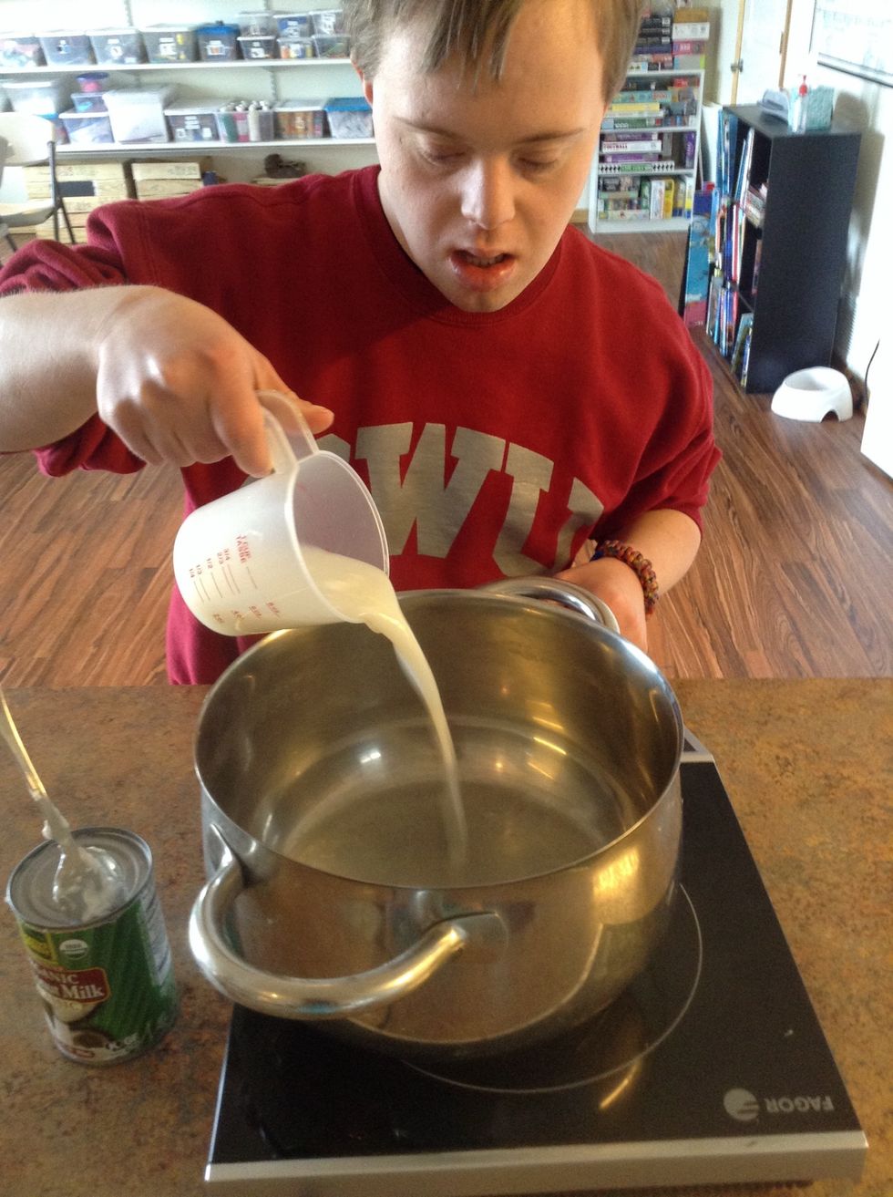 Add 1/2 cup coconut milk to pot