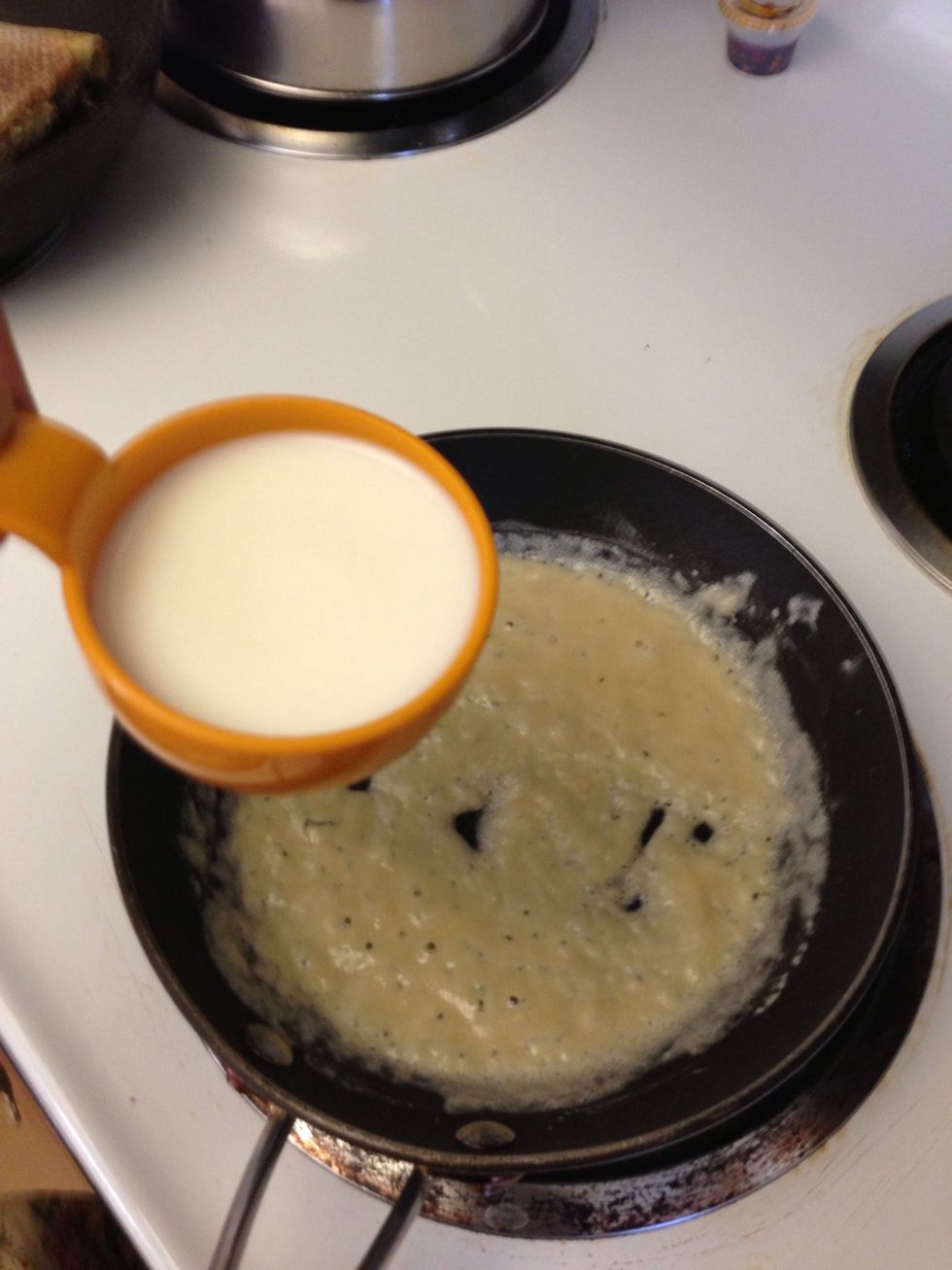 Add 1/2 cup milk and whisk