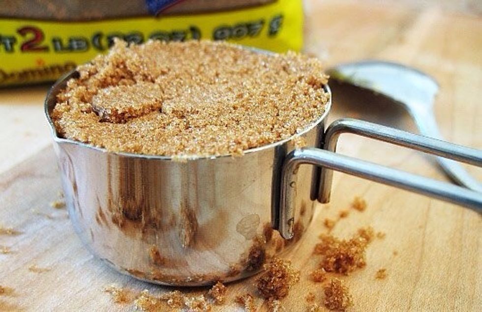 Add 1/2 cup of compact brown sugar to the same bowl and mix until merged.