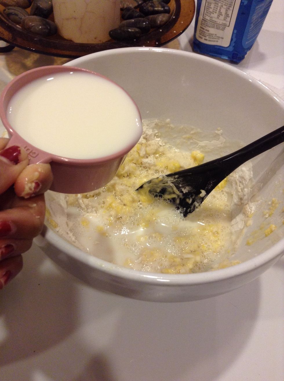 Add 1/2 cup of milk to the mixture.