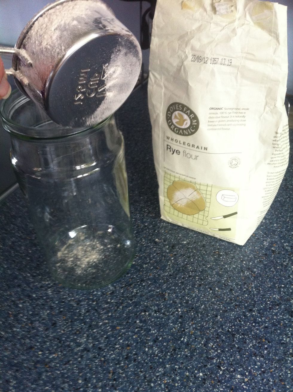 Add 1/2 cup of rye flour to a clean empty jar