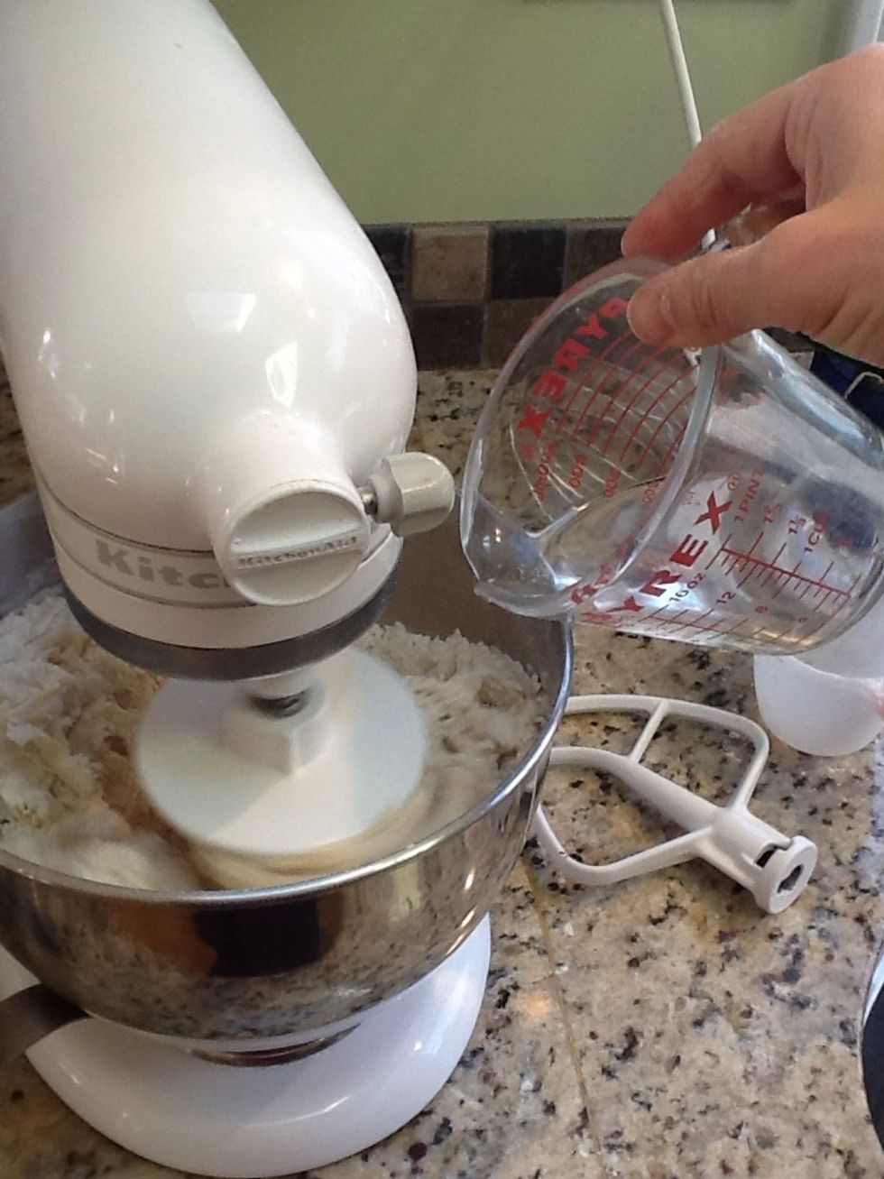 Add 1/2 cup of warm water while mixing