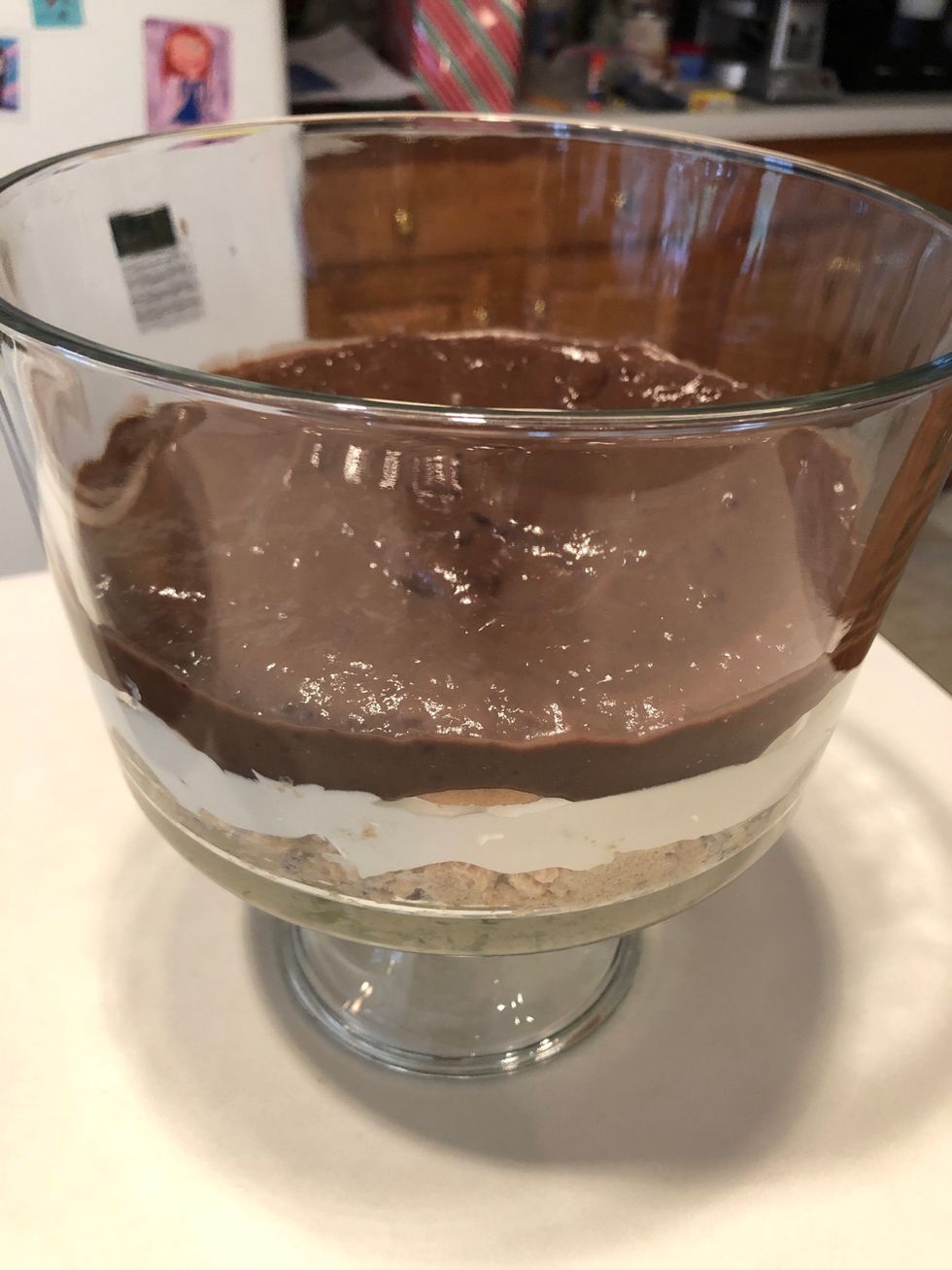 Add 1/2 of pudding mixture to top layer of trifle after it thickened for 5 min in the fridge.