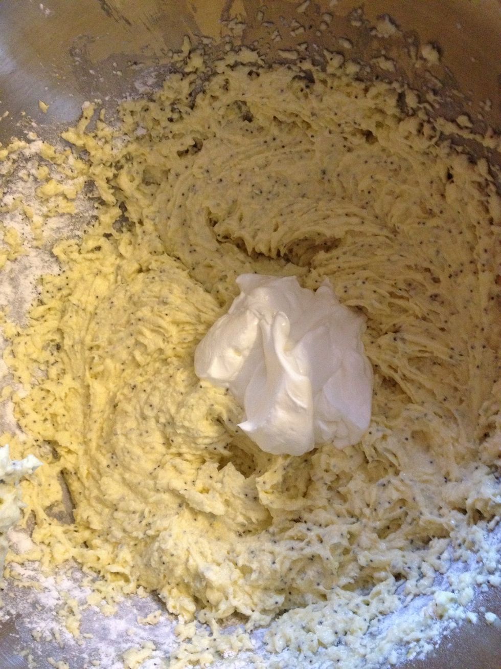Add 1/2 of sour cream & beat well. Repeat with remaining flour & sour cream. Blend well.