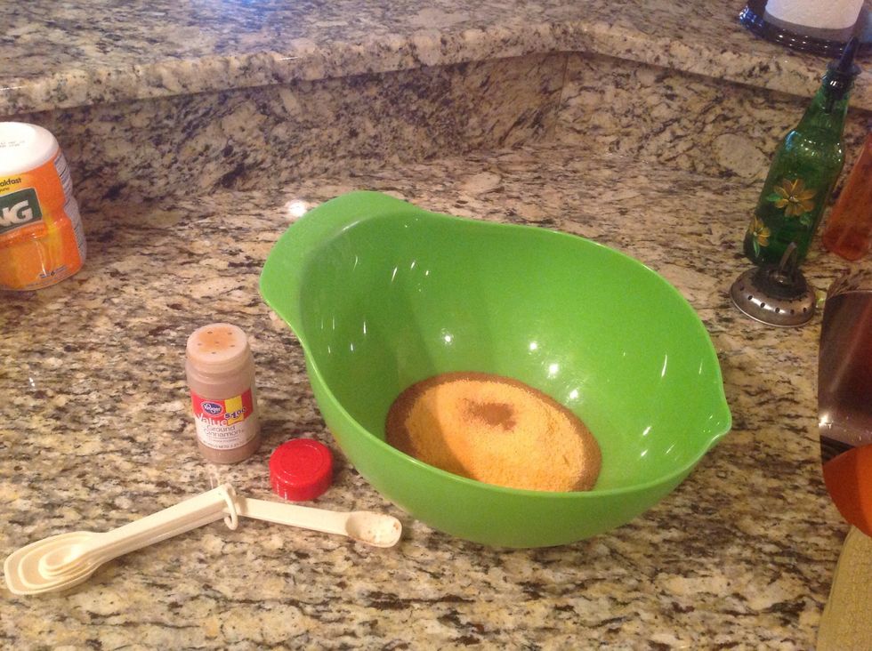 Add 1/2 tablespoon of ground cinnamon into the large bowl.