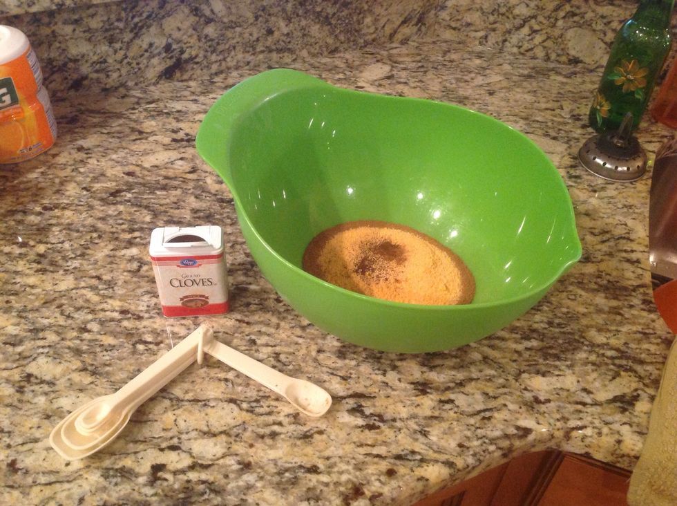Add 1/2 tablespoon of ground cloves into the large bowl.