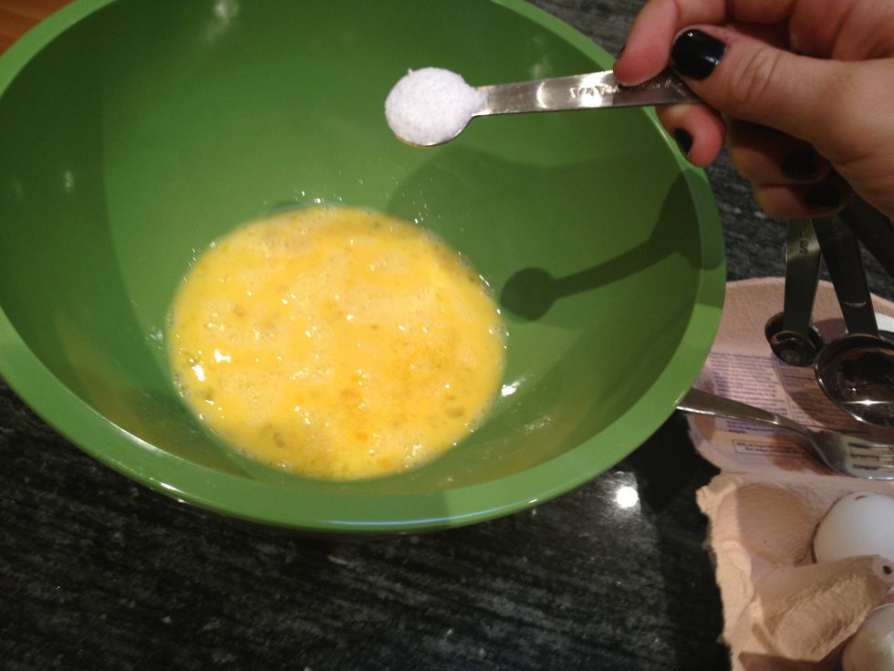 Add 1/2 teaspoon of salt to the eggs.