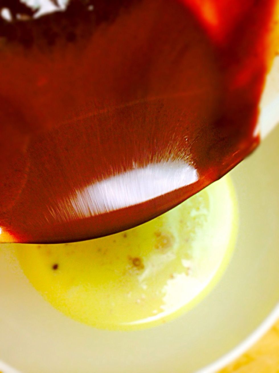 Add 1/2 teaspoon vanilla extract in each bowl. Pour melted white chocolate in one egg mixture with 2 tablespoons sugar. Mix, and then milk chocolate in another with 4 tablespoons sugar. Mix as well