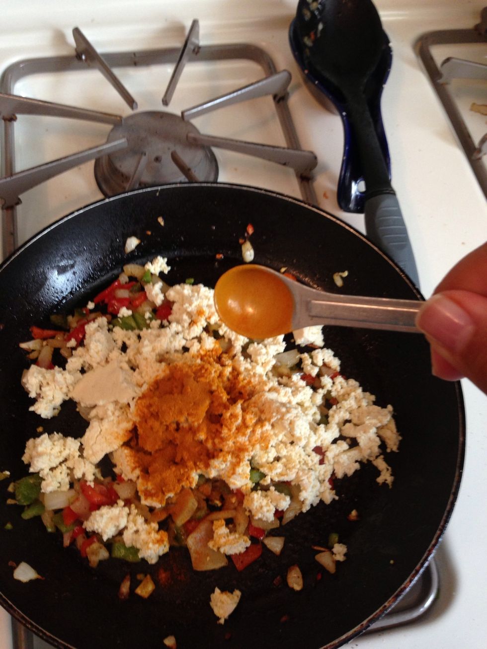 Add 1/2 tsp of turmeric. Stir for 1 minute