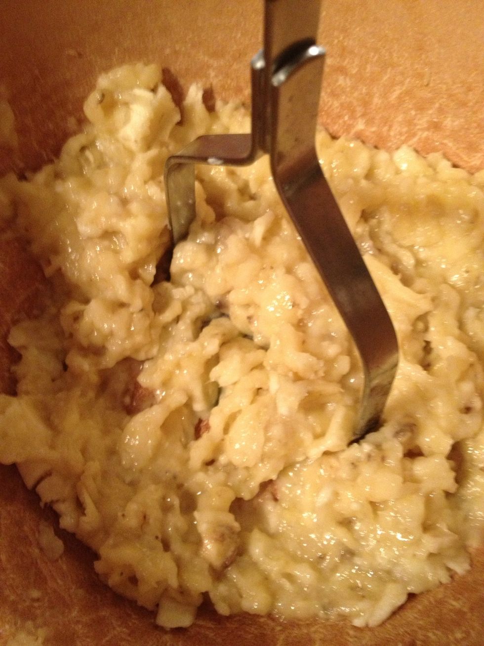 Add 1/3 cup melted butter to smashed bananas
