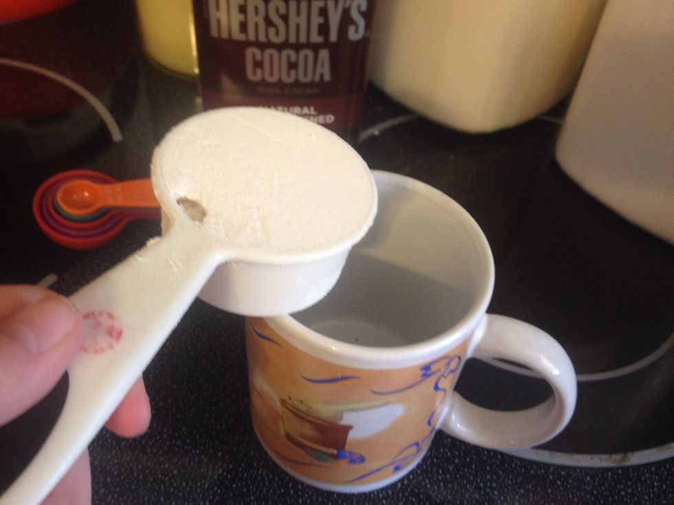 Add 1/4 a cup of the all purpose flour to the mug