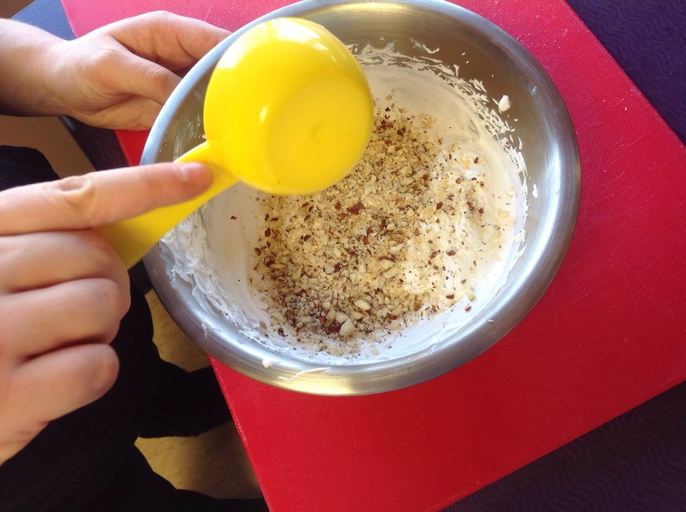Add 1/4 cup of chopped hazelnuts to mixture