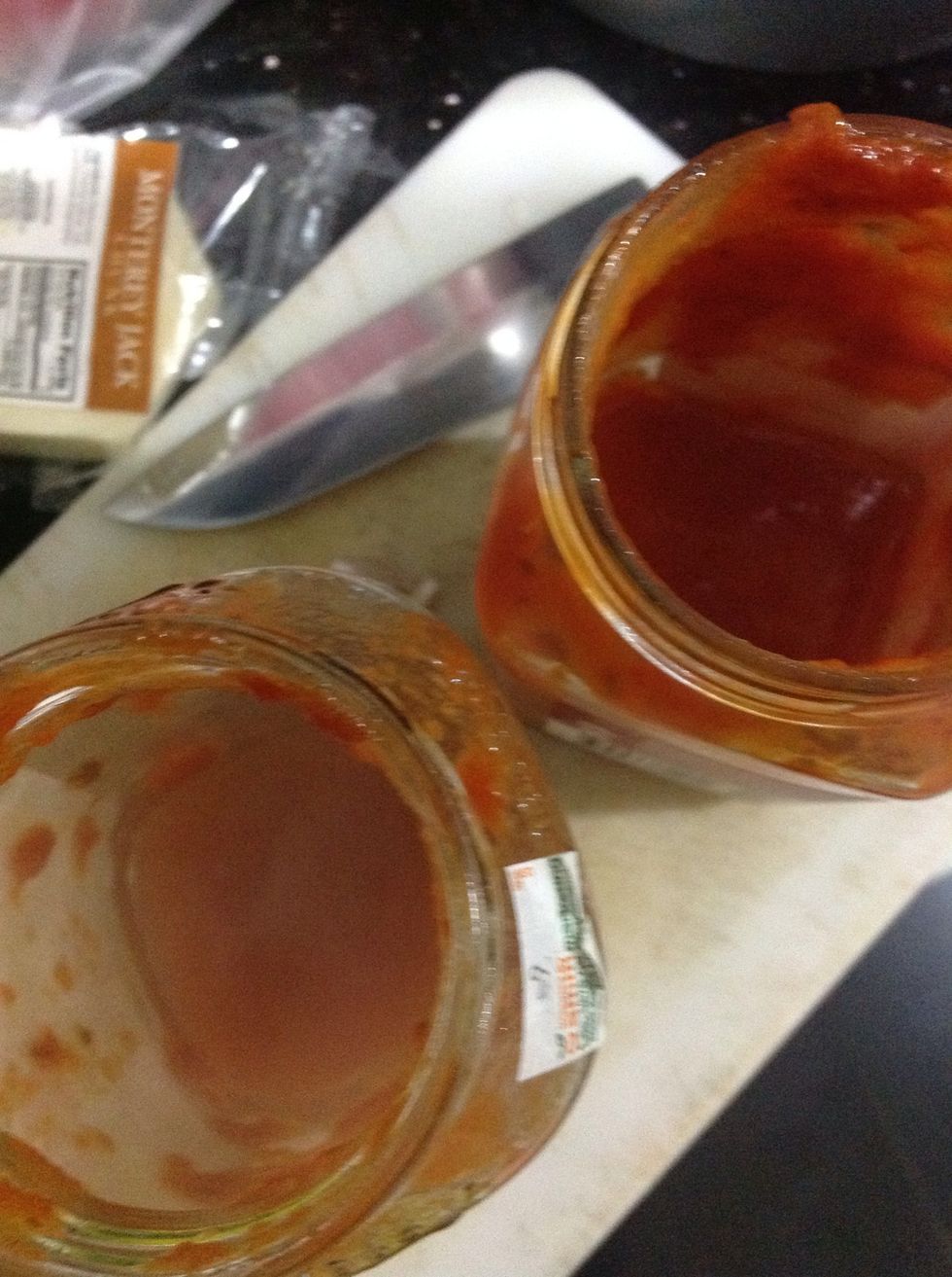 Add 1/4 cup of hot water into each jar.