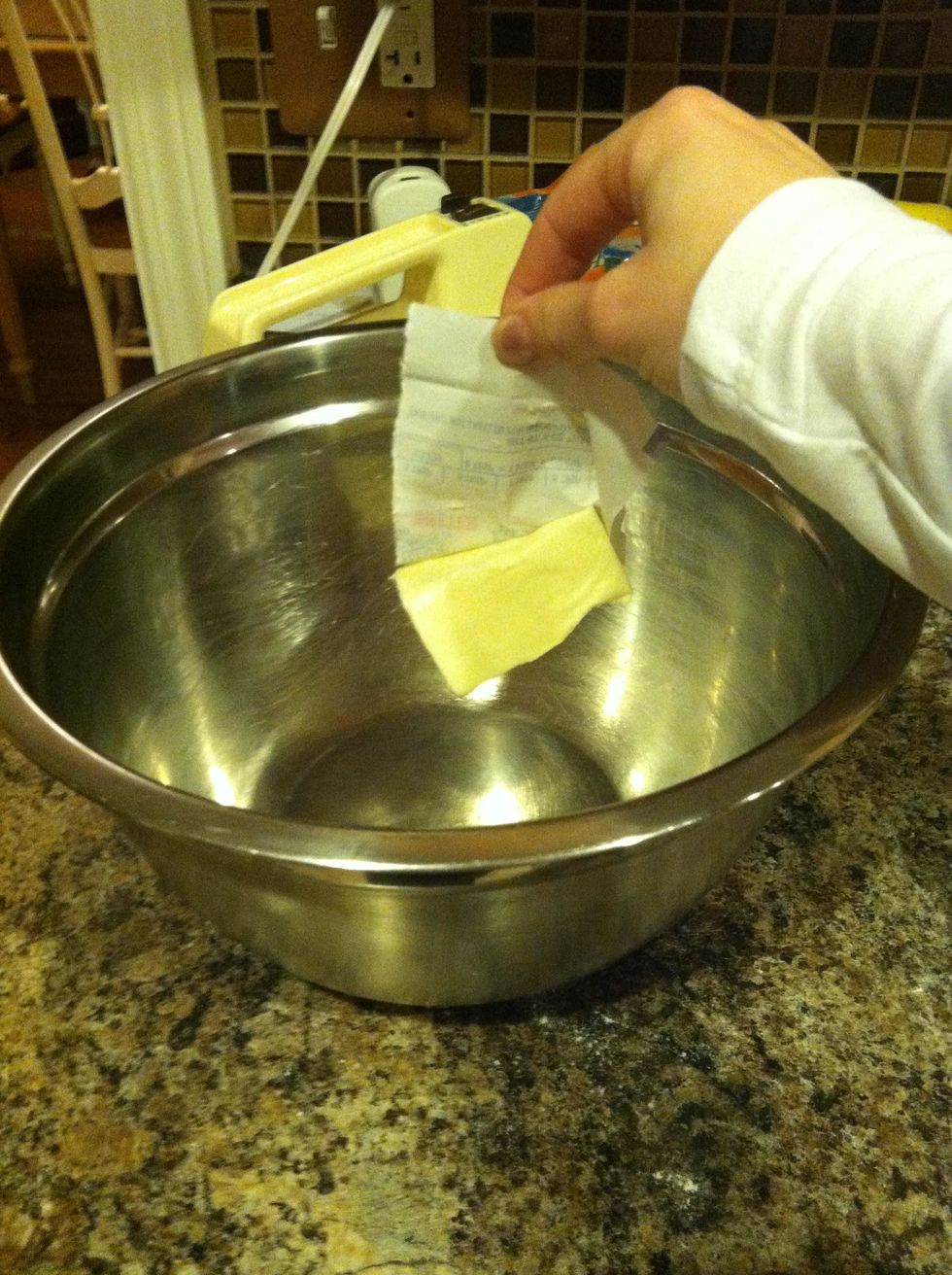 Add 1/4 cup of room temperature butter to a medium sized mixing bowl.