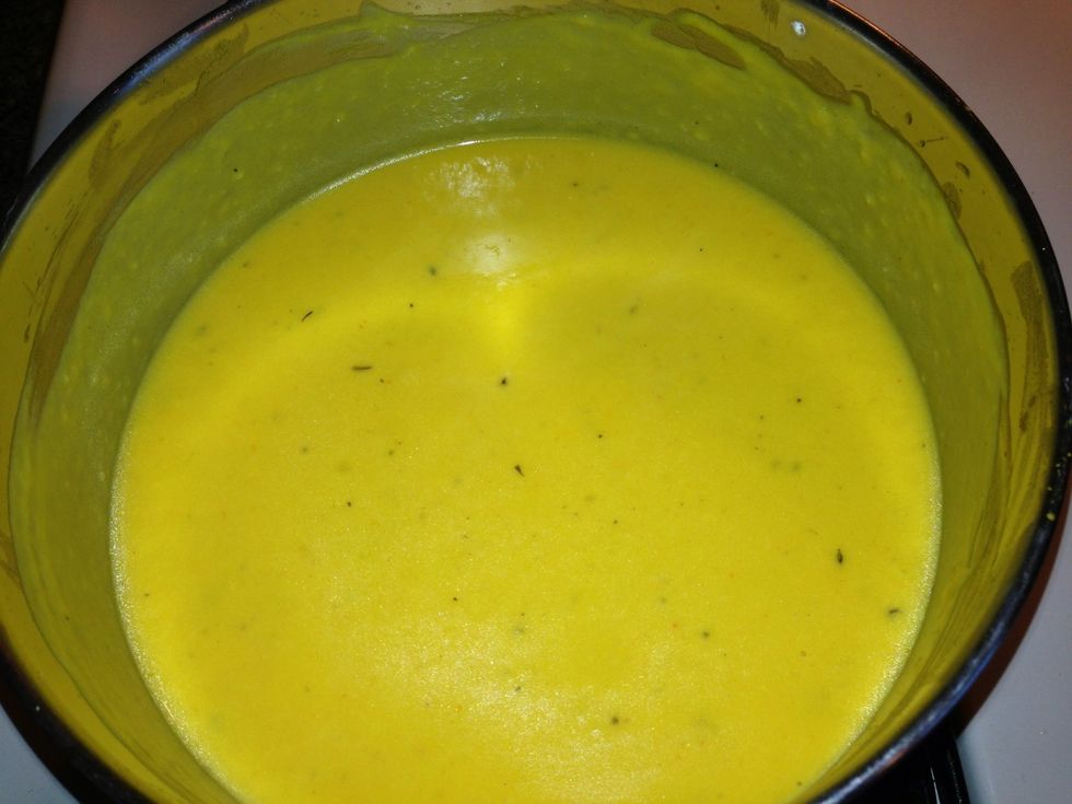 Add 1/4 cup Parmesan cheese and two cups shredded cheddar. Stir constantly getting into edges of pan until the cheeses are completely incorporated and smooth.