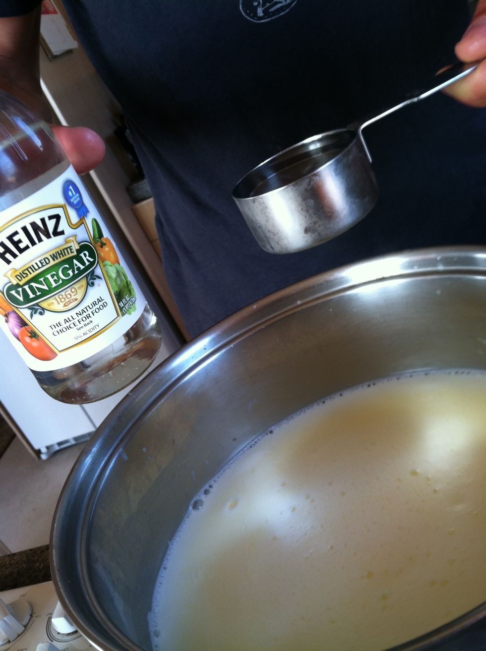 Add 1/4 cup white vinegar and stir.