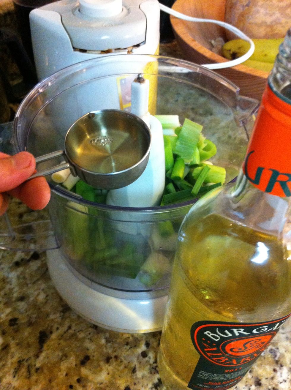 Add 1/4 cup white wine, 1/4 cup extra virgin olive oil, 1/4 cup water to the garlic in the blender. Don't blend just yet...