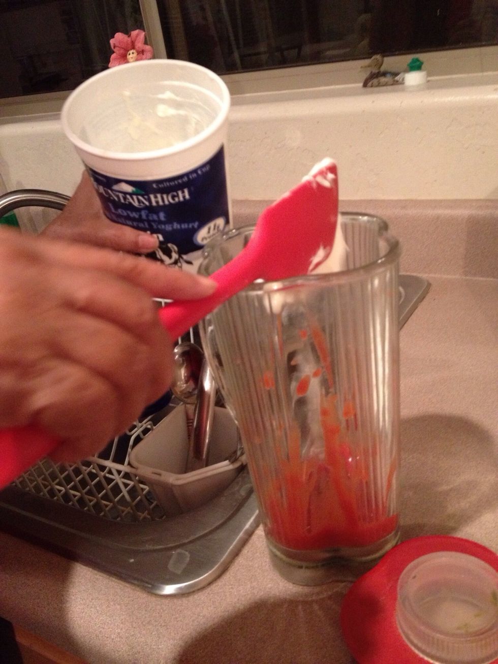 Add 1/4 cup yogurt into blender containing tomato sauce.