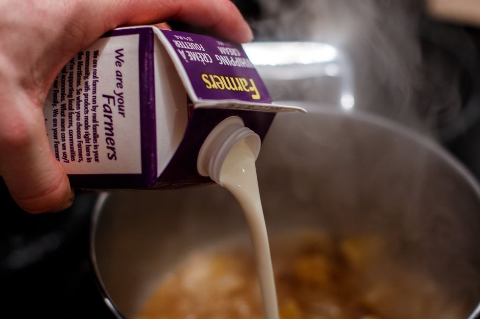 Add 1/4 of the cream and bring it to a boil. Once boiling, add the rest of the cream and then reduce it until your desired thickness.