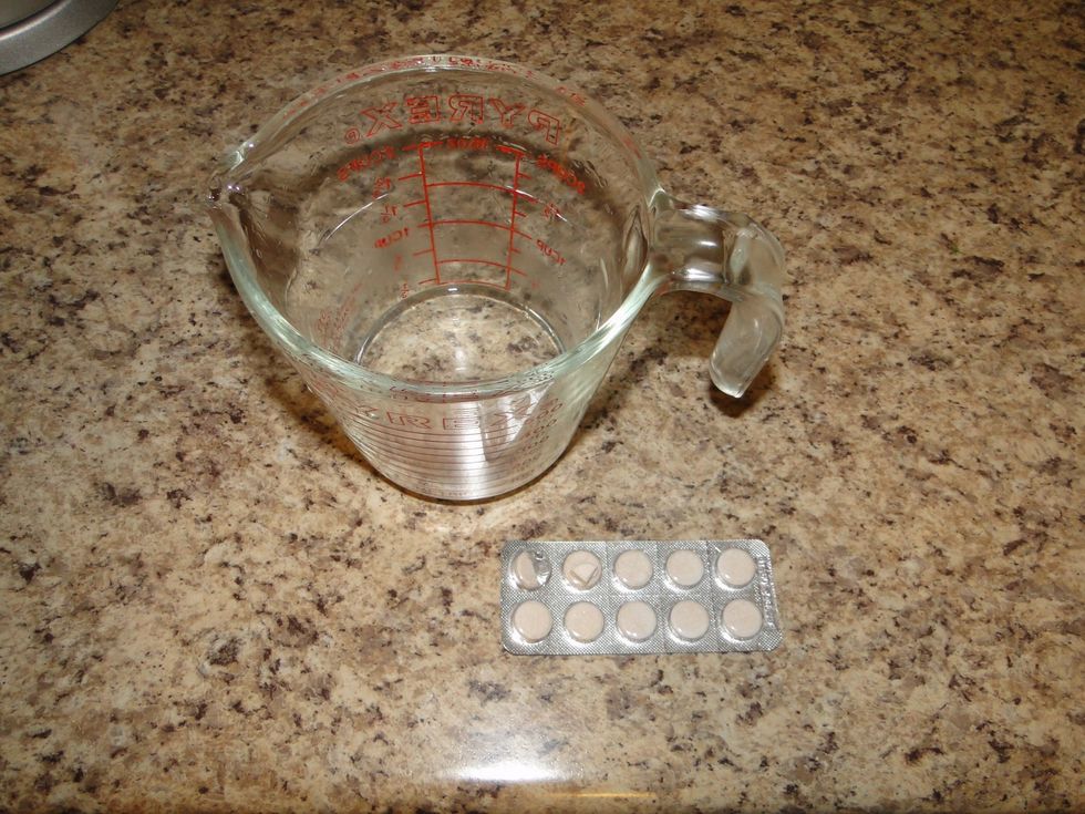 Add 1/4 Rennet tablet to 1/4 cup water and add to heated milk mixture and stir in very gently,this will cause the curd to start forming.