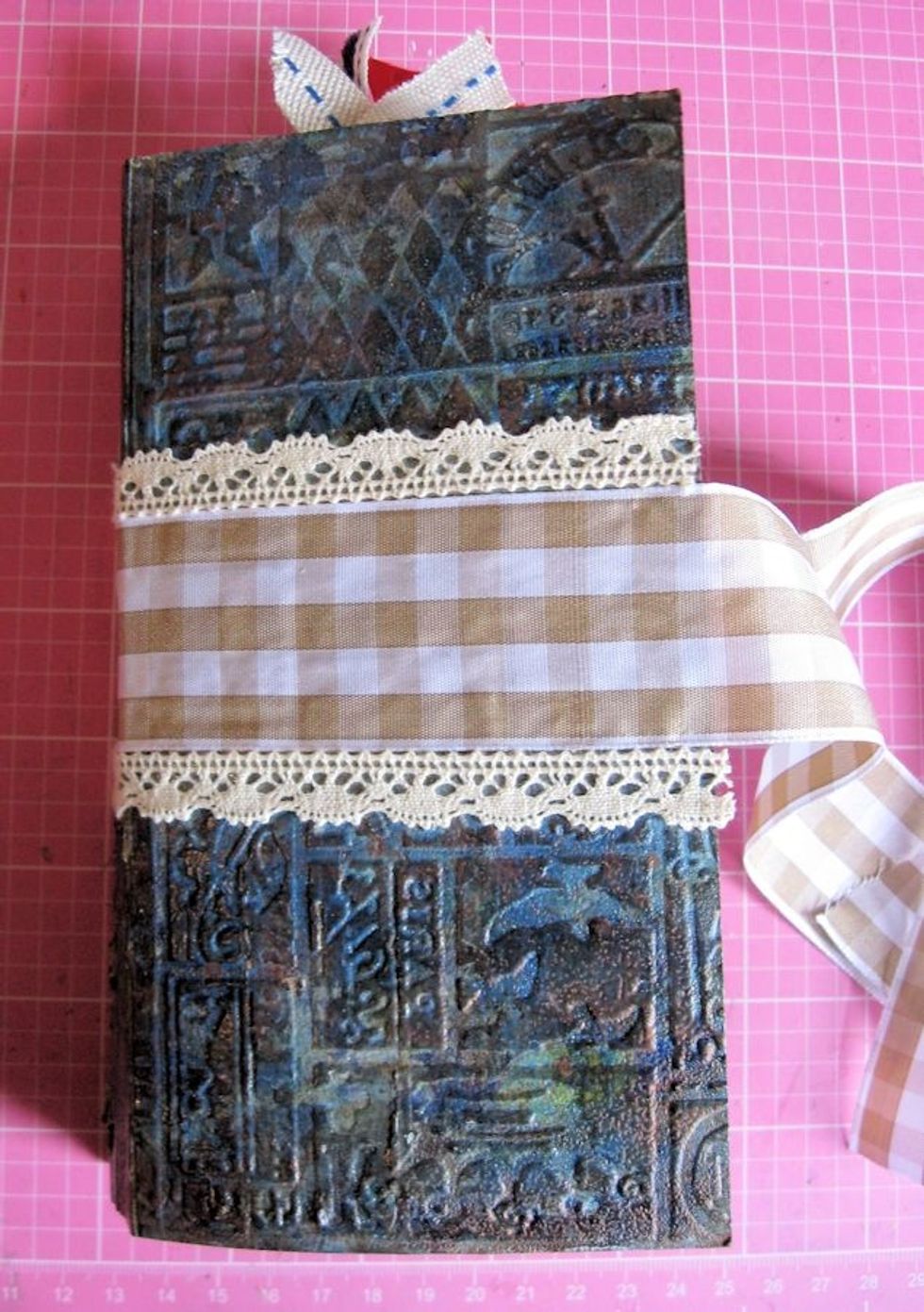 Add 1.5" antique gold plaid ribbon and crocheted lace over the exposed Scor-tape.