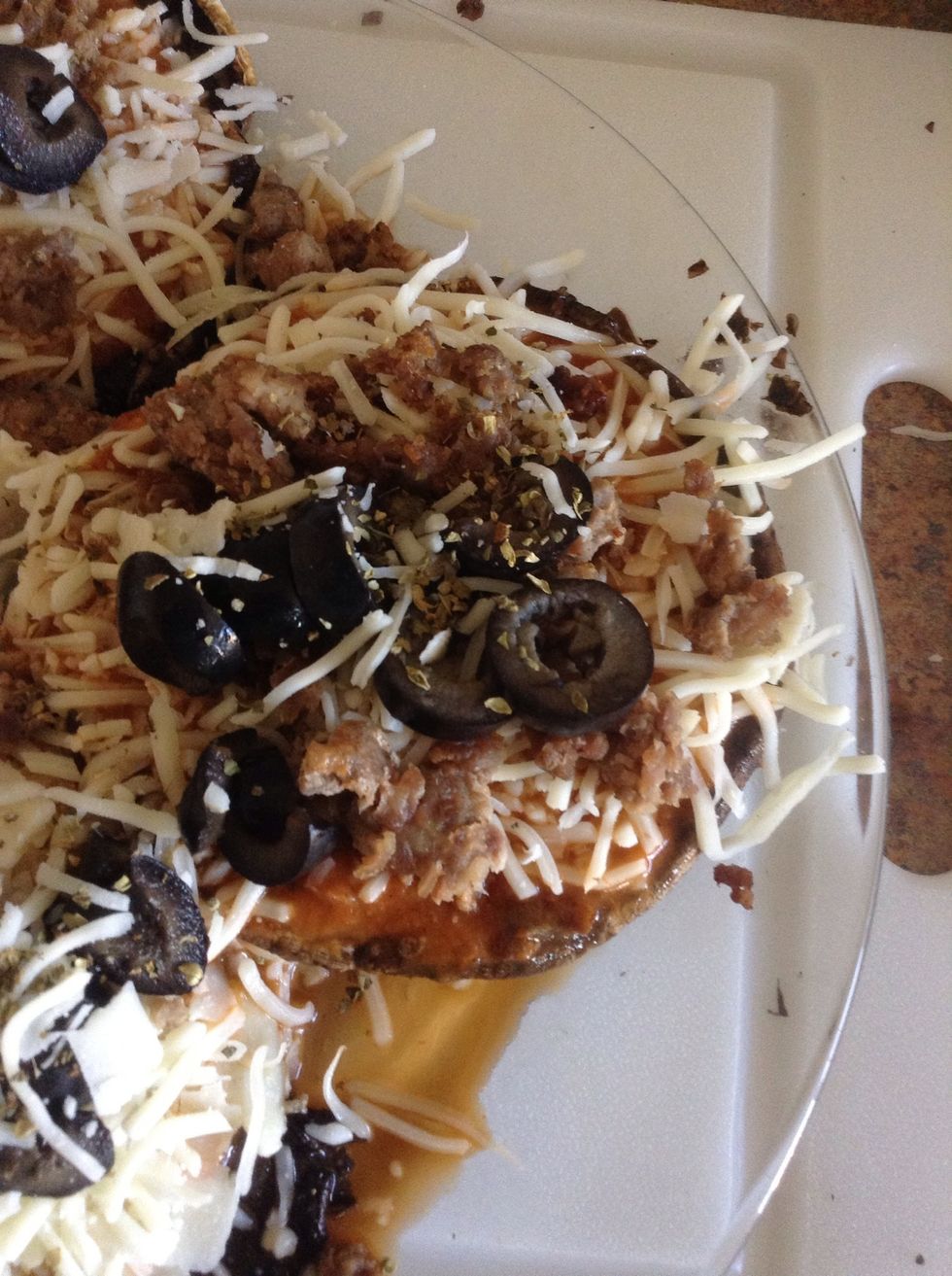 Add 1/8 teaspoon of oregano to top of each cap