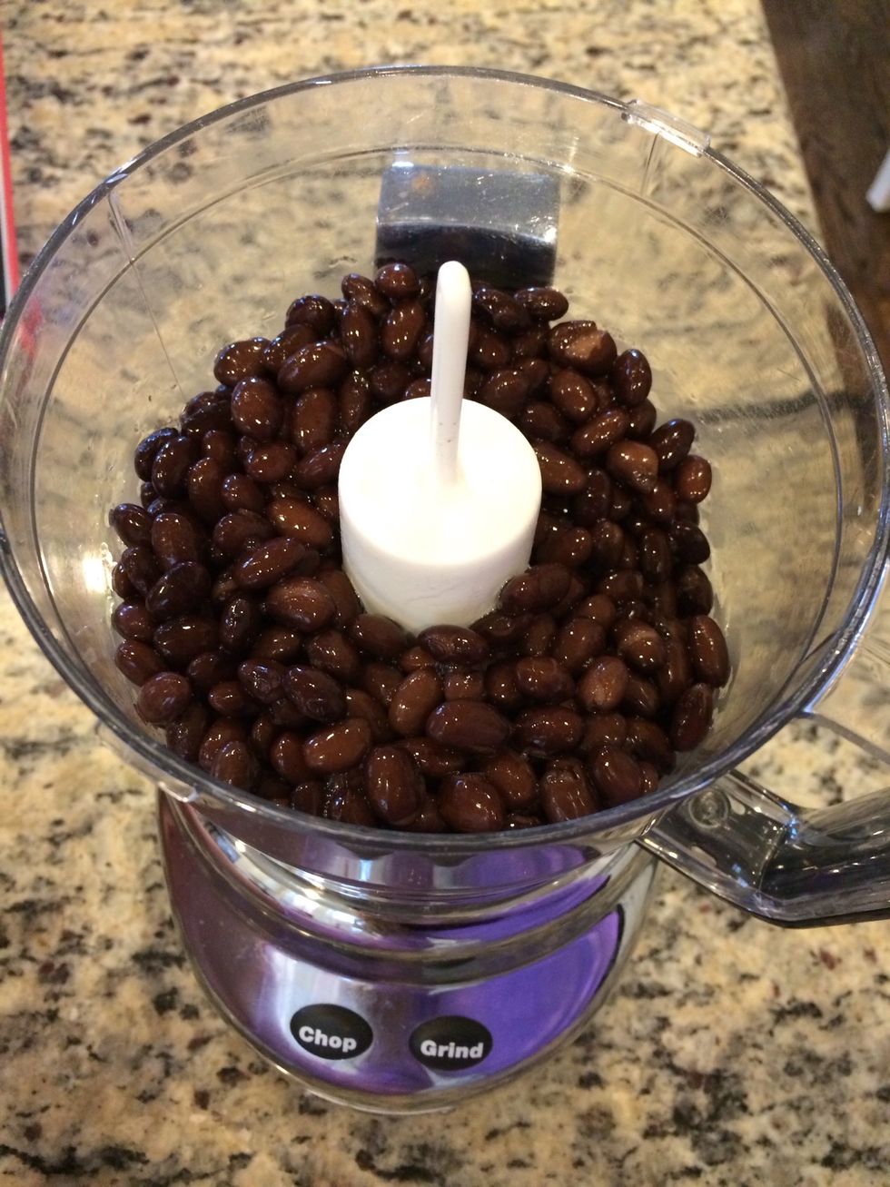 Add 1 can of strained black beans to food processor