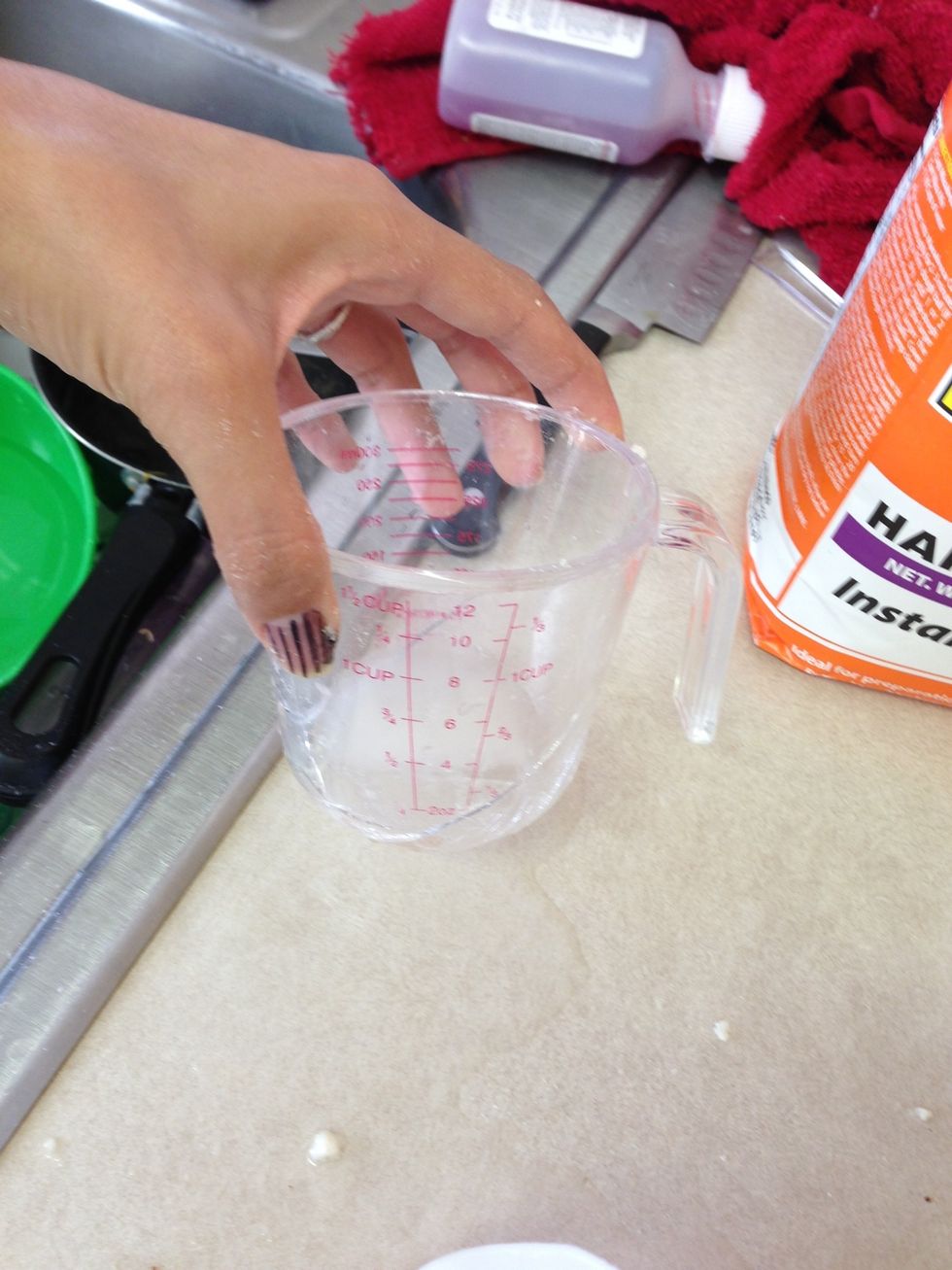 Add 1 cup & 1/8 of water and mix until it forms to dough