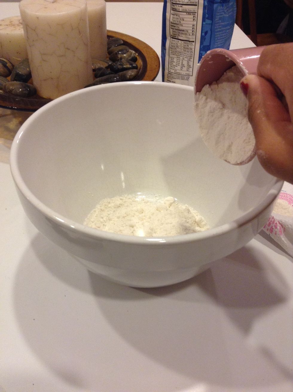 Add 1 cup of flour in the mixing bowl.